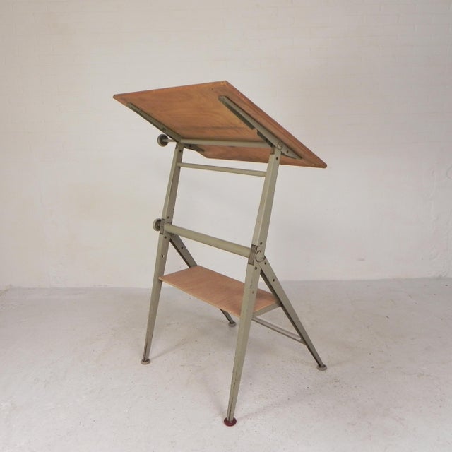 This drafting table, which can also be used as a desk, is a fine example of "Dutch Design." The ingenious mechanism...