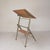 This drafting table, which can also be used as a desk, is a fine example of "Dutch Design." The ingenious mechanism...