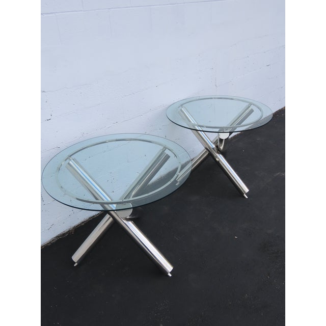 This Pair of Tables is made out of metal, chrome, and glass. The Tables have Milo Baughman Style, however they are not...