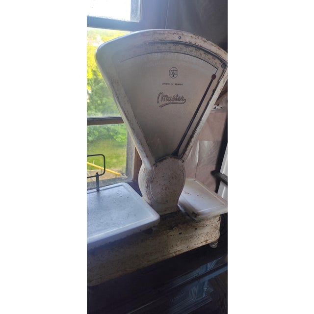 Authentic vintage industrial grocery scale by Master, imported from Belgium and dating to the mid-20th century. This...