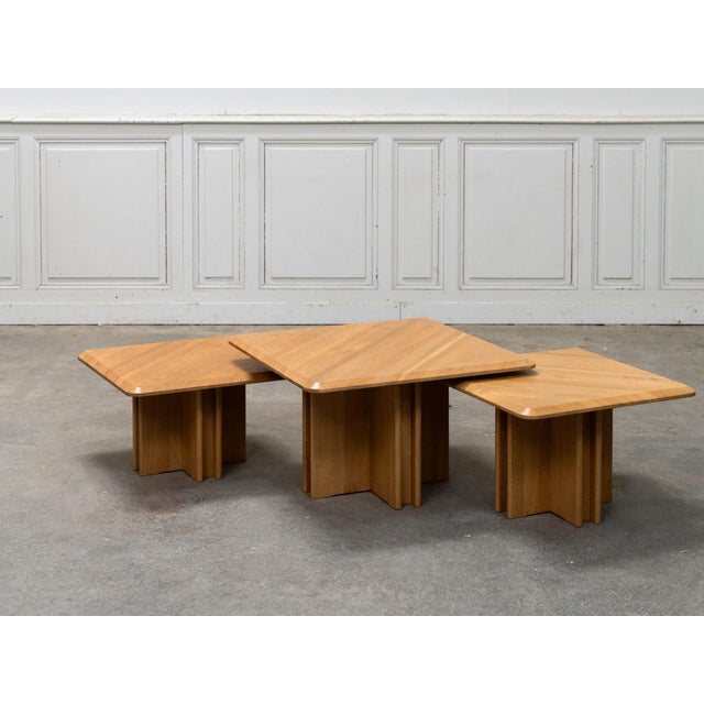 A lovely set of three nesting tables in light oak, dating from the 1980s. We love their simple, graphic lines, with square...