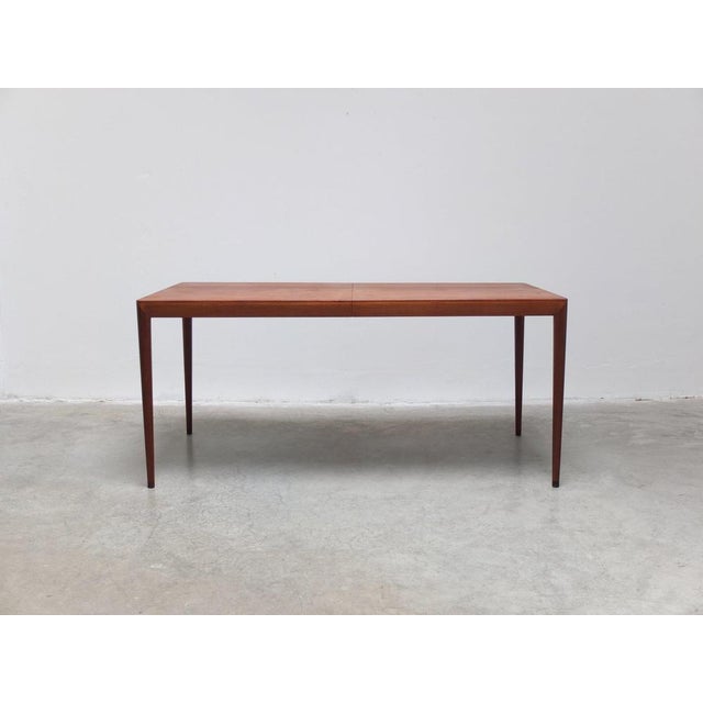 Beautiful dining table in teak designed by Erik Riisager Hansen for Haslev around 1960. Very high-end manufacturing with...