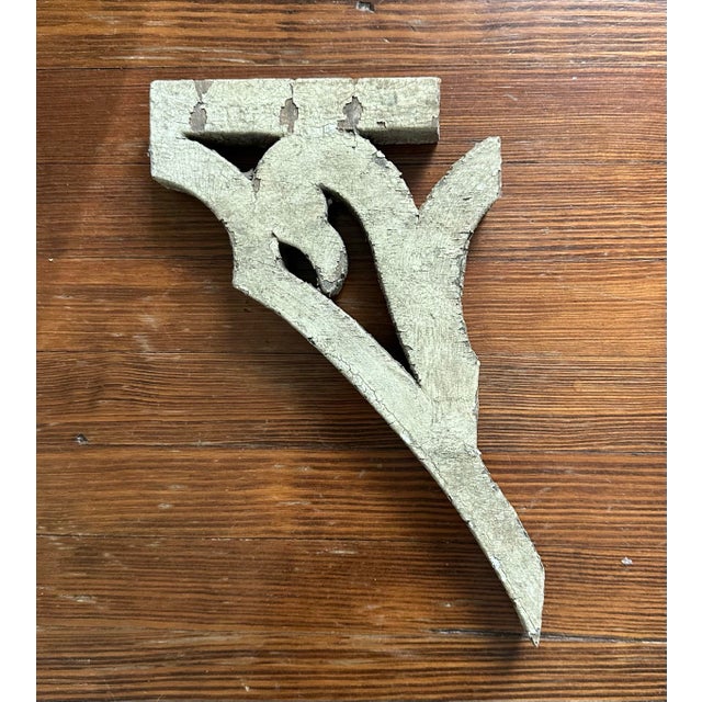 A gorgeous, antique wood corbel fragment. Features a scrolled, swan head bracket detail with a distressed finish in...