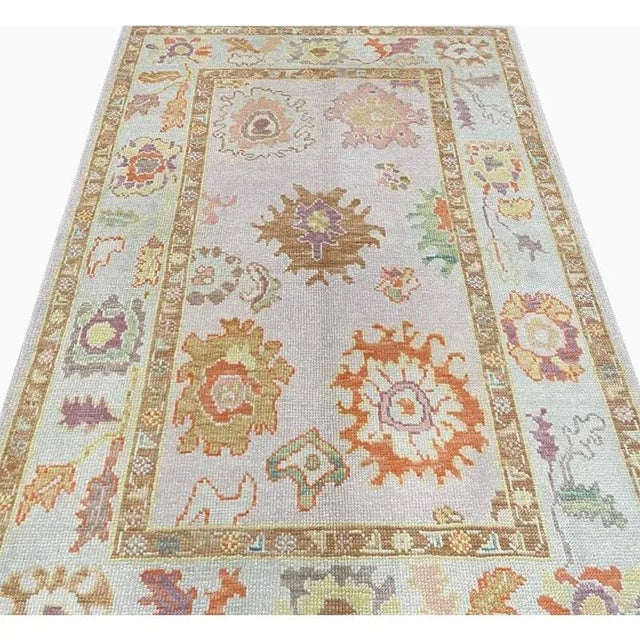 ACTUAL SIZE: 4’2″ x 5’10” PRIMARY COLOR: Lavender / Ivory Age: New AGE: Turkey MATERIALS: Wool FOUNDATION: Cotton...