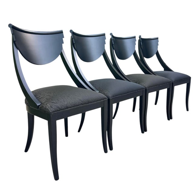Set of four Italian postmodern dining chairs designed by Pietro Costantini. These sculptural chairs feature dramatic...