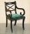 English Regency style Ebonised Sabre leg dining chairs with Green velvet upholstery which are part of a large suite...