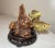 Up for sale is a wonderful vintage hand carved wooden bass sculpture. It has a lovely natural burl wooden base with two...