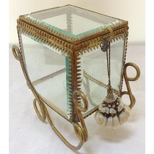 Beveled glass with brass frame carriage display case. 19th Century.