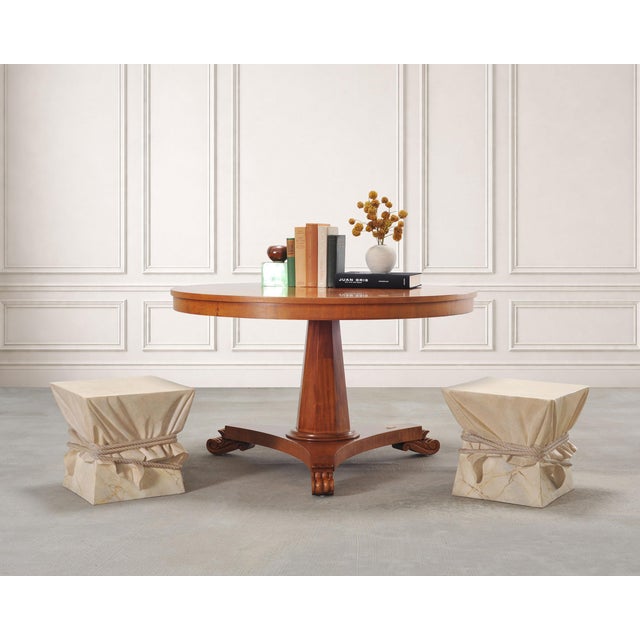 An elegant and rare signed round center or dining table crafted in the neoclassical Greco-Roman Palladian style designed...