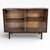 A refined mid-century modern sliding glass bookcase by Beaver & Tapley, designed by Richard Hornby, dating from the 1960s....