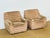 An elegant pair of armchairs from the 1970s, featuring a design typical of the era, combining comfort and generous lines....