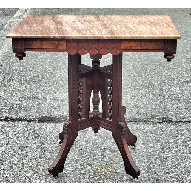 Late 19th Century Victorian Eastlake Style Walnut and Marble Top Rolling Center Table For Sale - Image 5 of 7