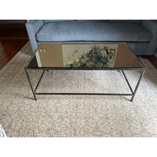 Sleek Oly Studio modern iron and mirrored coffee table by Oly, goes with any type of decor. Minimalist and understated...