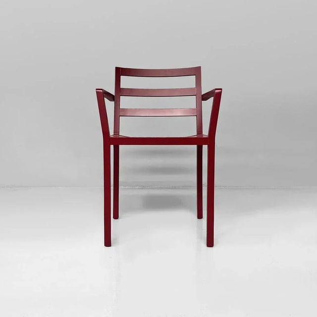 Italian modern armchair in burgundy varnished wood, 1980s Armchair in burgundy varnished wood. The backrest is made of...
