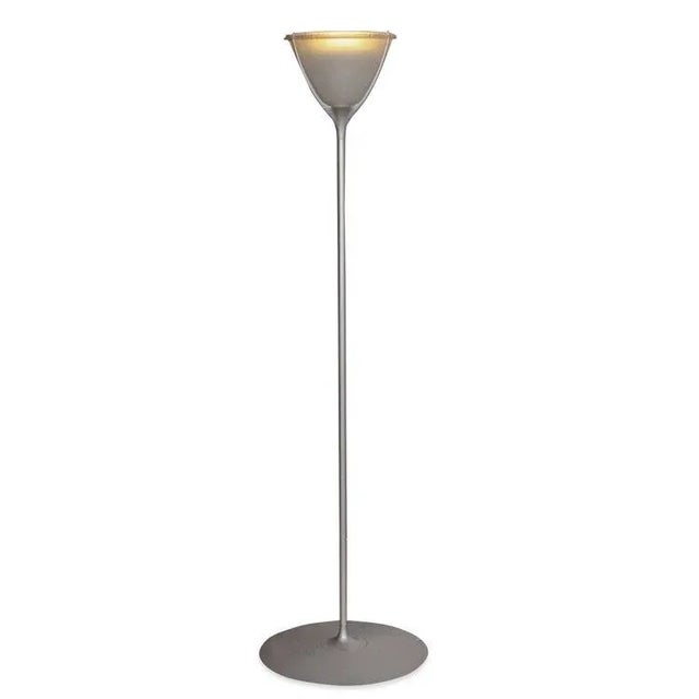 A dimmable floor lamp made in Italy with a frosted shade, designed by Philippe Starck in 1998 for Flos, made of aluminun,...