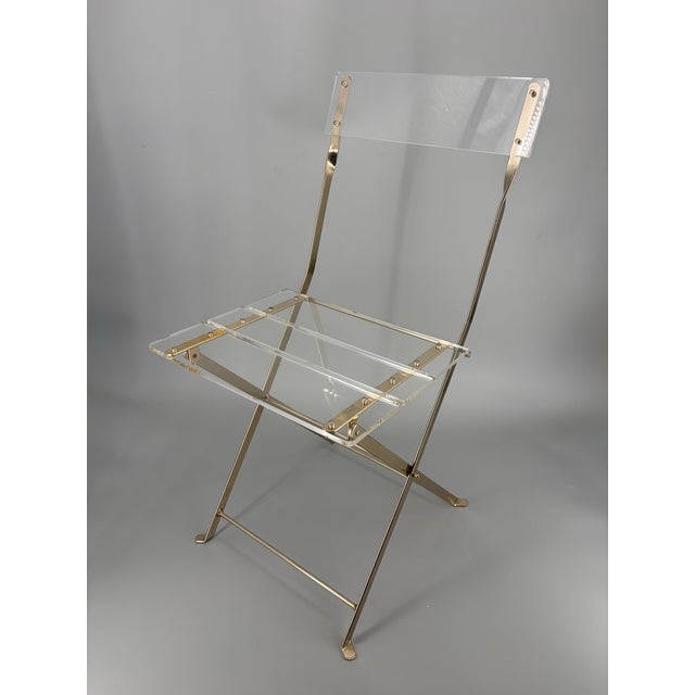 A folding chair * Legendary folding chair * In Hollywood Regency style * By Yonel Lebovici and Bernard Berthet * from the...