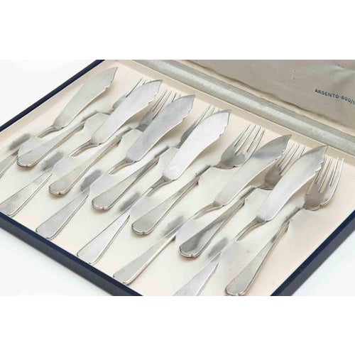 Elegant vintage Italian fish service set comprising 6 knives and 6 forks, presented in the original blue fitted case with...