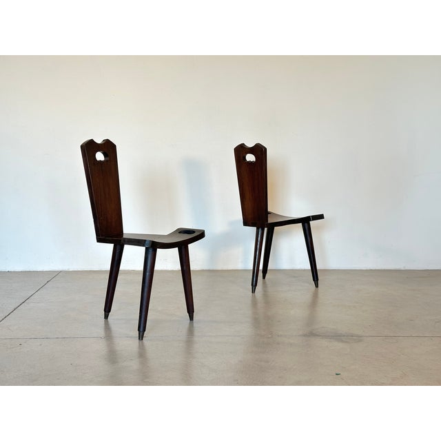 2 rustic wooden chairs from the 1960s, with brass tips
