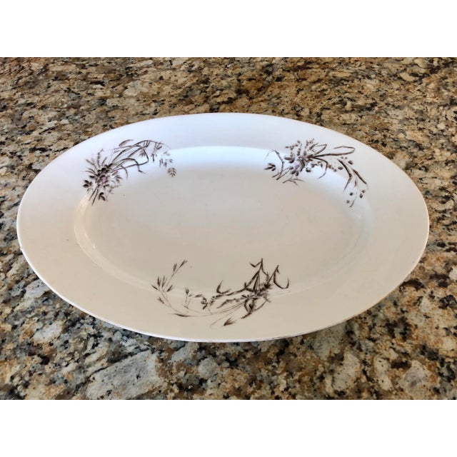 Very large white ironstone platter embellished with sheafs of wheat and pink florals. Created in France by Limoges...