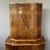 An Art Deco cocktail cabinet. Burr walnut veneered with satin birch banding with an upper mirrored lit interior and...