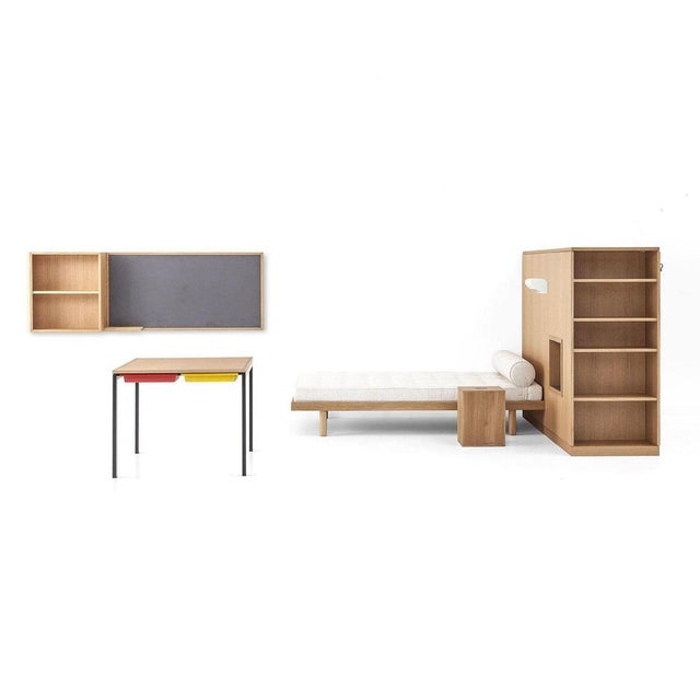 Reproduction of a student room in the Maison du Brésil, a set of a wardrobe-room divider, a bed, a desk, the Maison du...