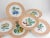 Vintage set of 7 Vista Alegre for Mottahedeh porcelain salad plates with salmon scalloped rim and mixed fruit patterns....