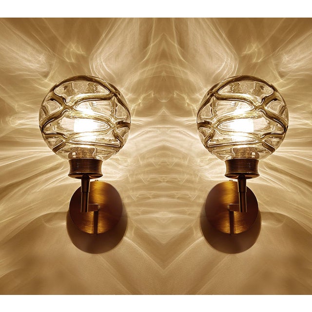 Pair of Vintage sconces by Doria 1970s, brass structure with structured cocoon Murano glass globes with dark sage green...