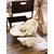This large clam replica serves as a bowl or decorative object. Its resin construction beautifully mimics the details of a...