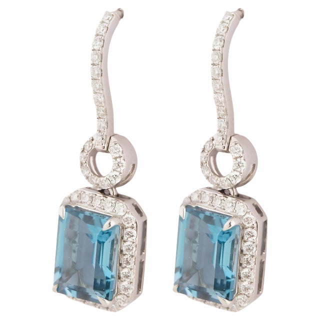 GW=5.676gm NW=4.454gm blue topaz=5.39cts diamond =0.72cts THIS IS A BRAND NEW PIECE