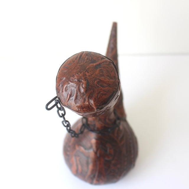 Very cool vintage leather wrapped Spanish porron decanter. The leather is beautifully tooled in a flower pattern with a...