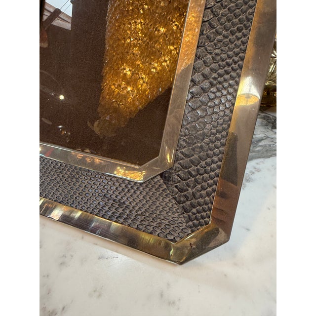 Striking vintage picture frame featuring an octagonal chrome border with a gray snakeskin-patterned surround. Its...