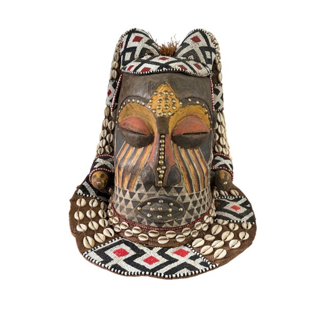 Stunning Vintage large Kuba royal head mask which is made of wood, cloth and raffia and decorated with beaded geometric...