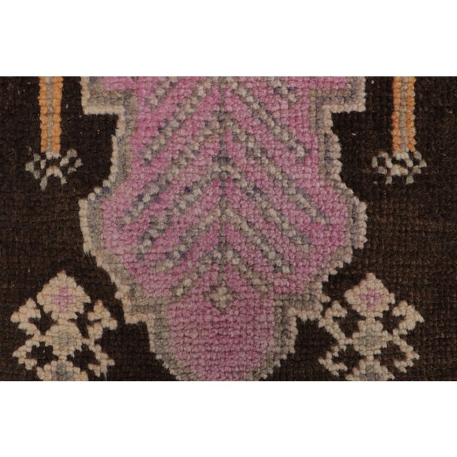 This gift-size vintage 2x3 Turkish rug, circa 1950–1959, features a distinctive geometric medallion design rendered in...