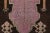 This gift-size vintage 2x3 Turkish rug, circa 1950–1959, features a distinctive geometric medallion design rendered in...