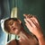 Mirrored Touch by Linda Delahaye | Oil on cradled wood panel of a woman with hands raised. For Sale
