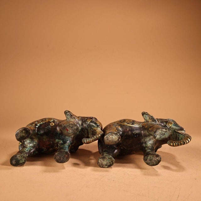 This is a charming pair of vintage Chinese bronze sculptures depicting elephants. Crafted from solid copper/bronze, the...