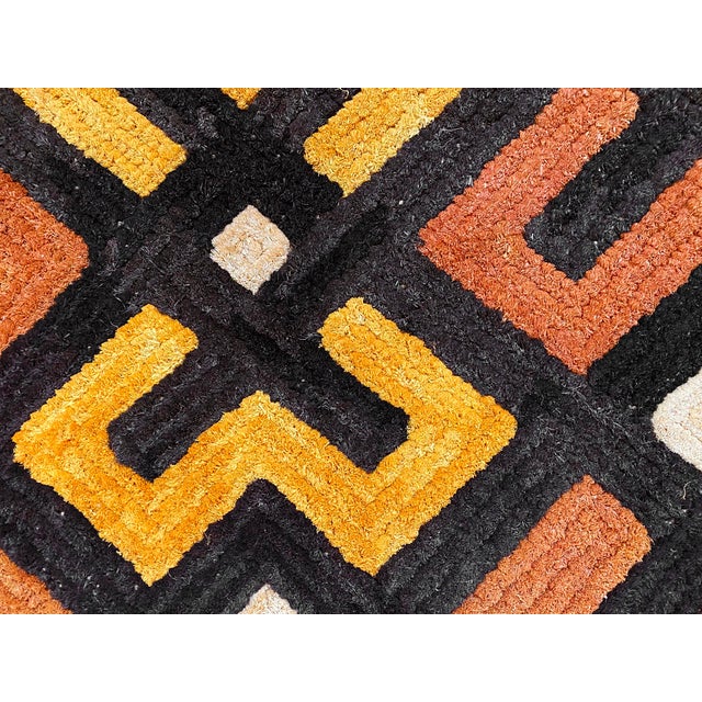 Traditional vintage Kuba grass textile handmade from the indigenous people of the Congo. Bold geometric patterns created...
