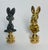 Whimsical pair of brass and metal rabbit figurines as lamp finials.