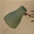 Very rare, unusual wall light consisting of steel and brass. The screen can be variably adjusted by the two ball joints....