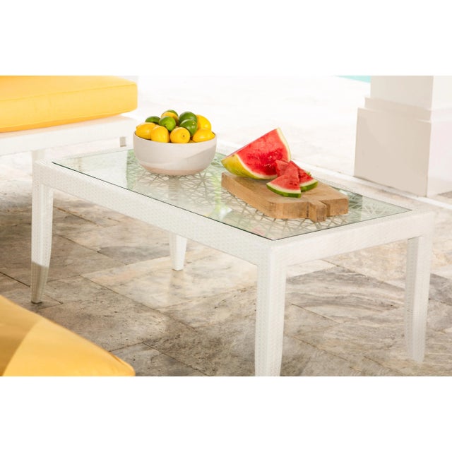 This David Francis Outdoor Woven Coffee Table features a UV-resistant fiber over a powder-coated aluminum frame. This...