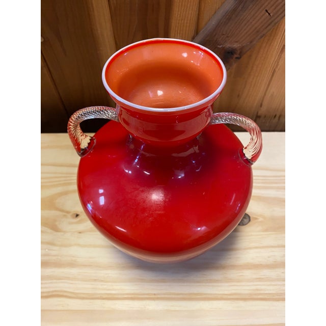 Beautiful vintage Italian glass vase with ornate twisted, clear handles. This red Opalina Fiorentina glass vase is a...