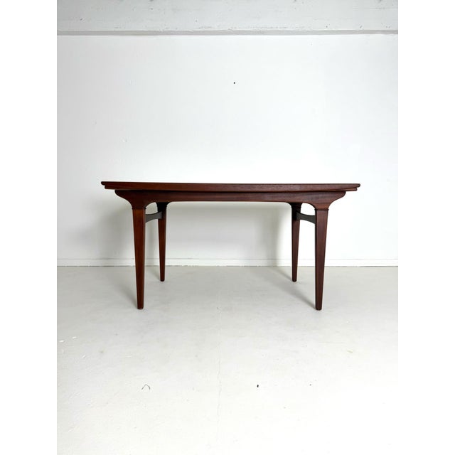 Johannes andersen – extendable teak dining table, uldum møbelfabrik, 1960s a refined and timeless danish dining table...