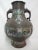 Late 19th century to early 20th century Chinese Bronze and Champleve urn with turquoise, cobalt, red, and green enamel...
