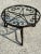 Round iron coffee table with rosette decor. Glass tray. No crack on the tray