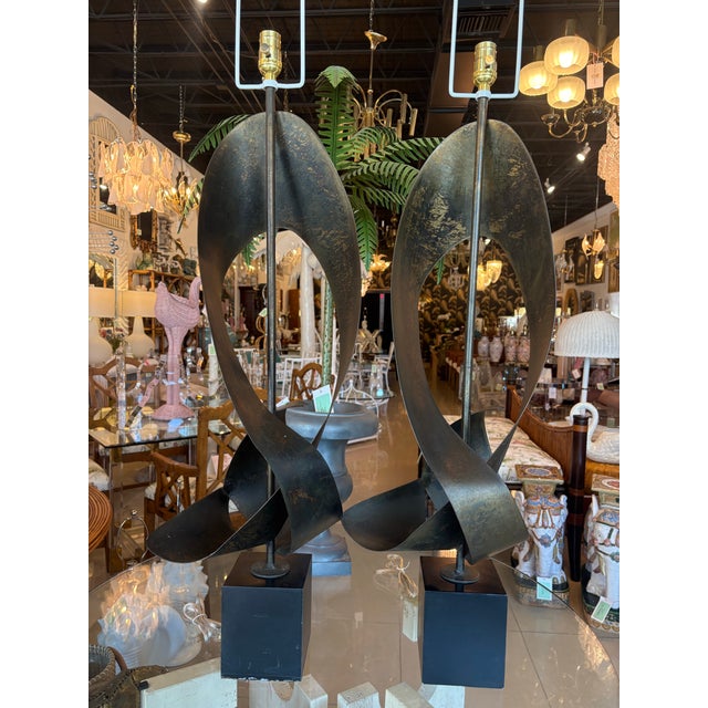 Vintage pair of Harry Blamer & Harold Weiss brutalist metal ribbon sculptural table lamps for Laurel, 1960s. These have...