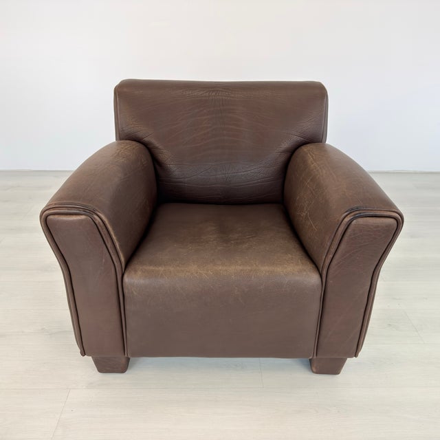 Dimensions: H 31” x W 37” x D 33” x SH 17.5” Vintage DS 97 lounge chair from De Sede in brown leather. Produced in...