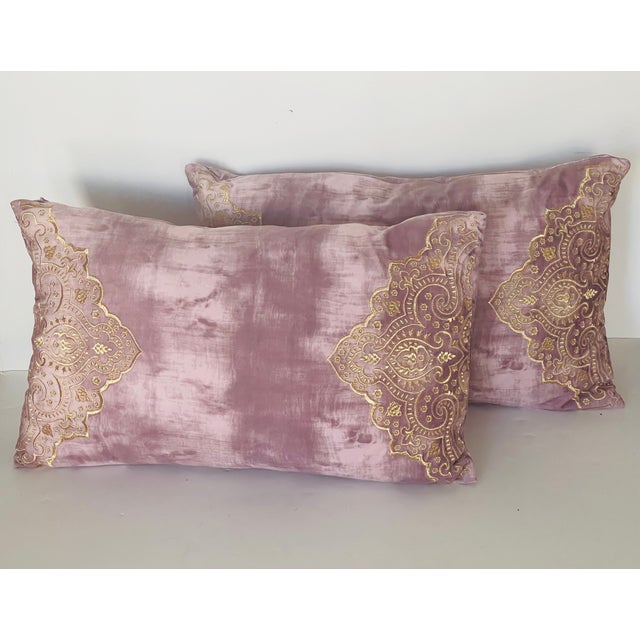 Elegant pair of blush pink velvet lumbar pillows with gold embroidery on both sides . Feather down inserts.