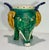 Add a touch of storied, sculptural charm to your space with this vintage Chinese-style sancai-glazed ceramic planter....