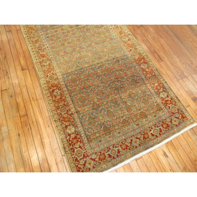 Finely woven persian senneh runner with a repetitive herati design. circa 1910