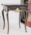 French Provincial Judson Rothschild “Wheels of Fortune” Black, Gilt and Glass End Table, 2006 For Sale - Image 3 of 5